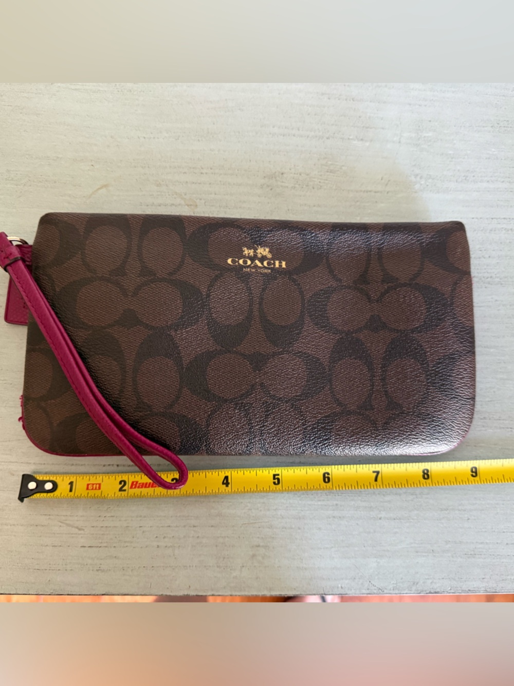 Coach Brown Signature Wristlet with Pink Strap